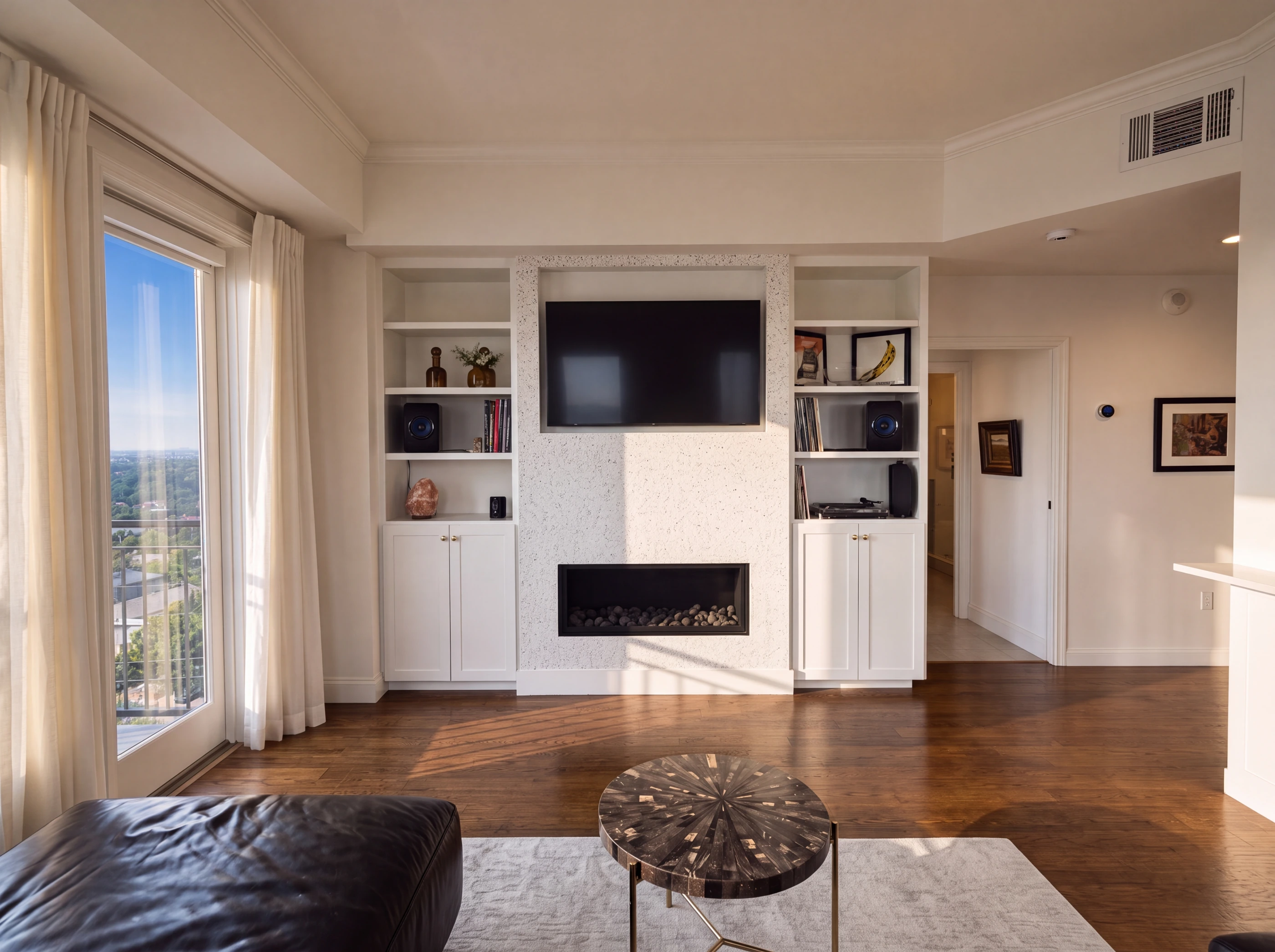 Living room with gas fireplace and built-in cabinetry
